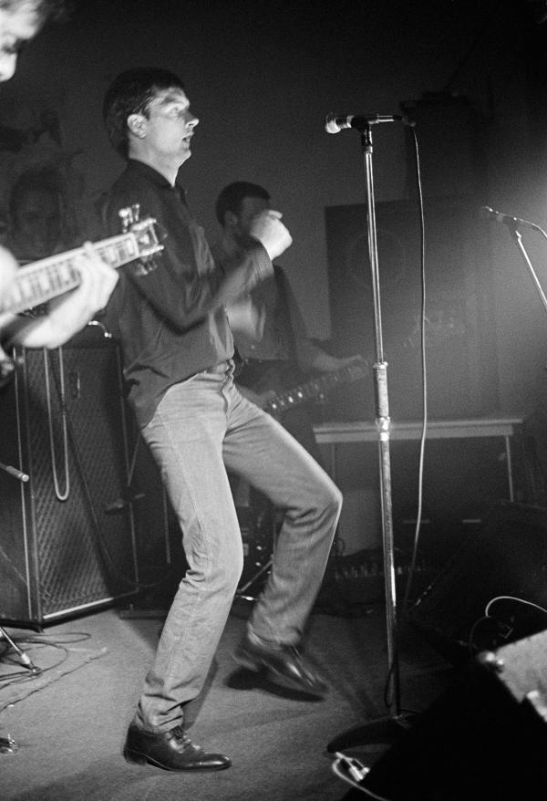Ian Curtis of Joy Division on stage at New Osbourne Club, Miles Platting, Manchester. 7 February 1980