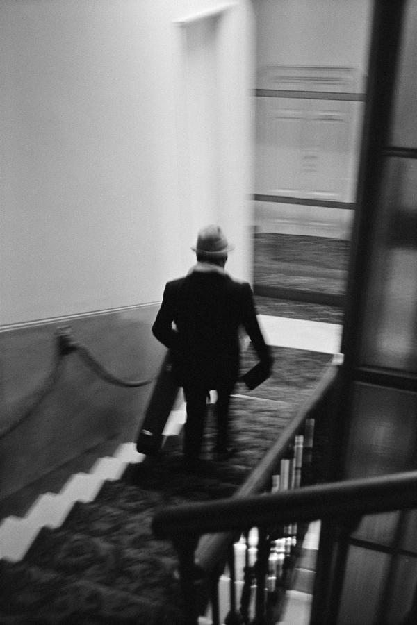 Julian Bream leaving hotel for a performance, Milan. 15 March 1981