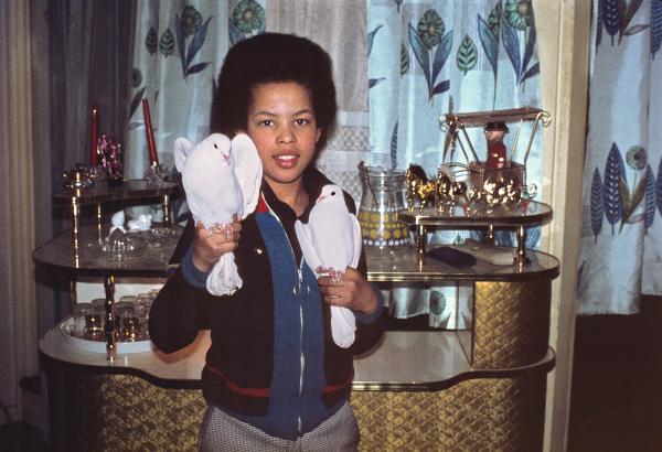 Mrs Emare’s son with doves and bar, Hulme, Manchester. February 1974