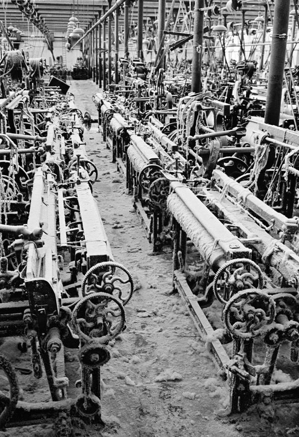 In the weaving shed, empty loom alley. August 1976