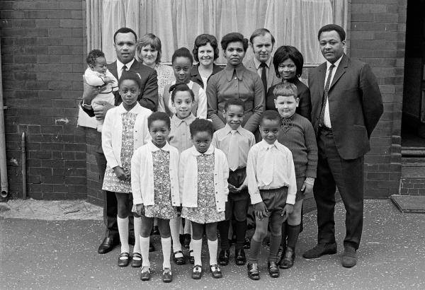 Group portrait at a christening. Moss Side, Manchester. 1972