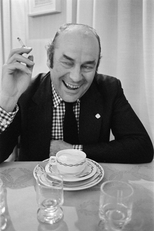 Julian Bream, guitarist., in a restaurant while on tour, Padua, Italy.  March 1981