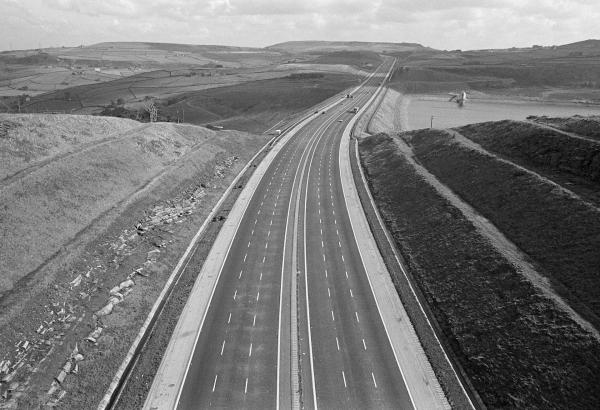 M62 motorway near Ripponden, Scammonden Reservoir to the right, West Yorkshire. October 1973