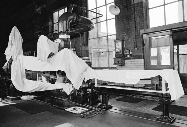 The engine house during wakes week. High pressure cylinder, conrods and tail slide covered with fent (waste cloth). July 1976