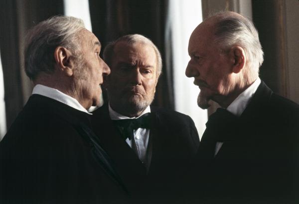 Sir Ralph Richardson [Pfordten], Lord Olivier [Pfeufer], Sir John Gielgud [Pfistermeister] officials at the court of ‘mad’ King Ludwig II of Bavaria, on set at the Hofburg Palace, Vienna. January 1982