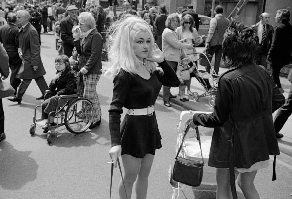 Crowd breaking up after watching city centre carnival procession, Manchester. Spring 1973