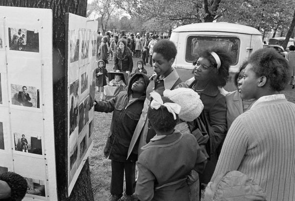 Impromptu exhibition of portraits made in The Shop on Greame Street. Caribbean Carnival, Alexandra Park, Moss Side, Manchester. Whitsun Bank Holiday, 1972
