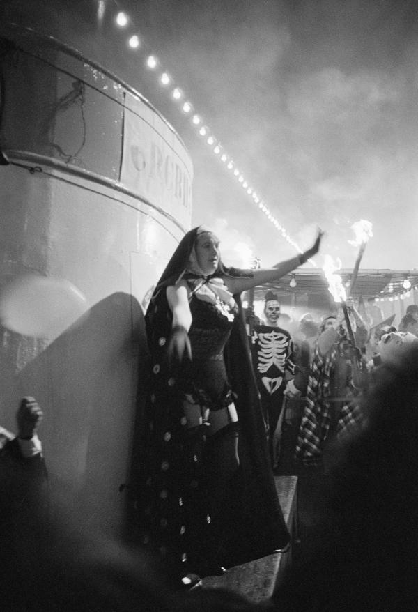 Celebrated lady professional wrestler Mitzi Mueller [pornographic nun] at the Night Carnival Of The Dead. Location: Lakeside and Haverthwaite Railway, Windermere. February 1987