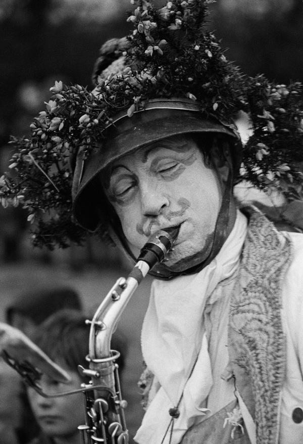 Performer John Fox playing saxophone. Mayday celebration, Burnley and Barrowford along the Leeds-Liverpool canal. 1 May 1976