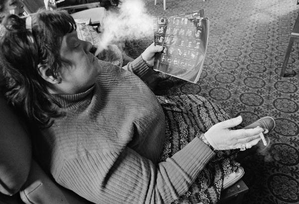 Evelyn Clarke, a former housewife, examines the photographer’s contact sheets. February 1978