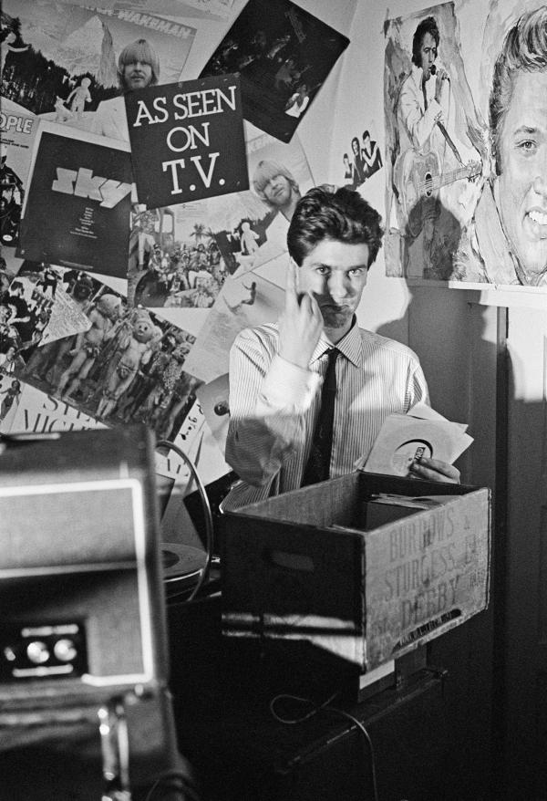 Jon Sage (aka ‘Jon Savage’) DJ-ing at New Osbourne Club, ‘Factory’ gig, Miles Platting, Manchester. 7 February 1980