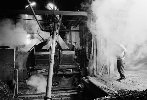 Stanley Graham, engineer, ‘blowing off’ and ‘blowing down’ the Lancashire boiler (emptying it) ready for fluing. Wakes holiday, July 1976