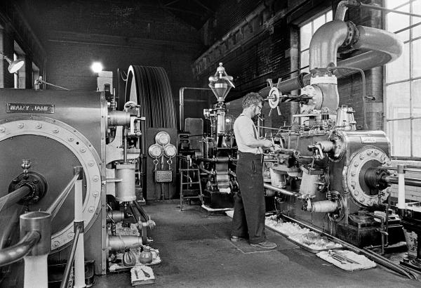 In the engine house with Stanley Graham, mill engineer. Double acting cross compound condensing engine, made by William Roberts & Sons of Nelson, commissioned 1919. Photographed 1976
