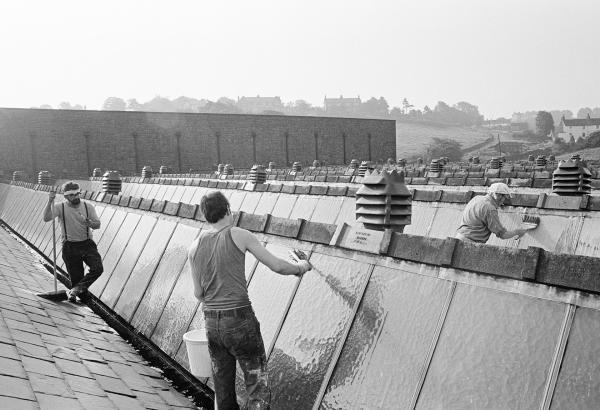Whitewashing the lights (glass) of the shed roof to keep out the summer sunshine and make it cooler for the weavers. Saturday 26 June 1976