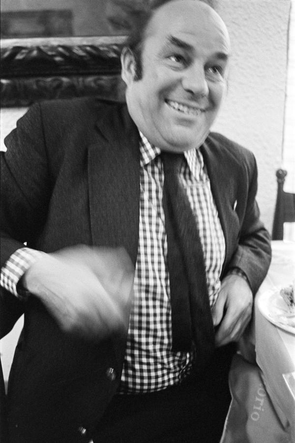 Julian Bream, guitarist, in a restaurant while on tour, Padua, Italy. March 1981