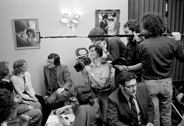 Filming on location, the ‘What’s On’ crew in a singles’ club, Mike Riddoch (in suit) conducts interview, David Liddiment directs, Manchester. April 1979