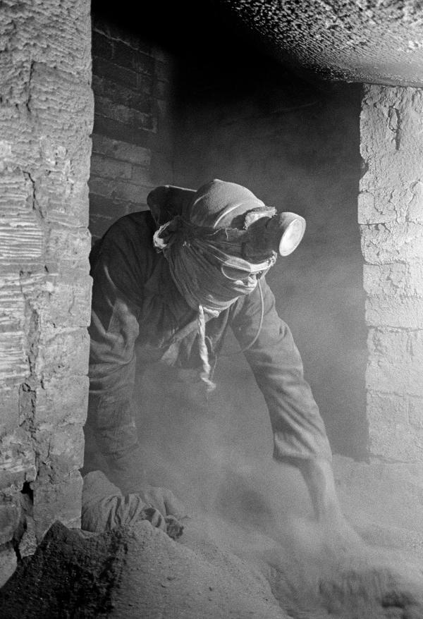 Exiting the side flue beneath the Lancashire boiler, while raking dust. Easter holiday, April 1976