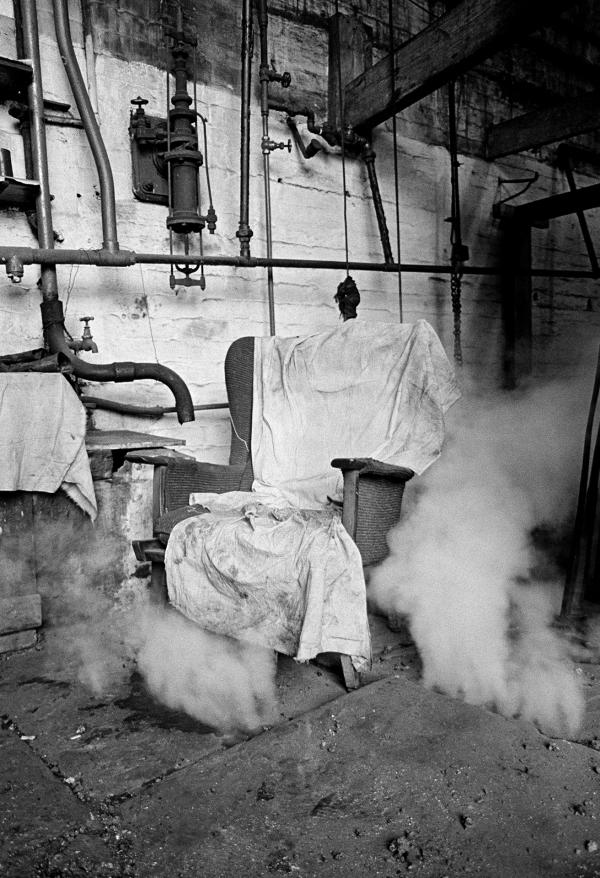 Boiler tenter’s (‘fire-beater’s’) chair during ‘blowing down’ of the Lancashire boiler (emptying it) ready for fluing. Wakes holiday, July 1976