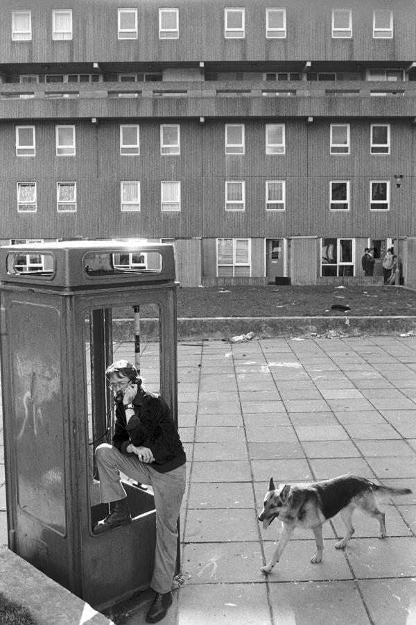 Life goes on while demolition takes place, Bessemer Park, Spennymoor, Co. Durham. February 1983